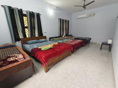 Tonse West House | Dormitory with 3 double beds and 1 single bed