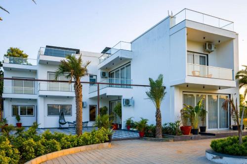 Bhiwadi Villa | ELIVAAS AdhiVa 5-BHK Farmhouse with Private Pool, Bar & Lush Garden