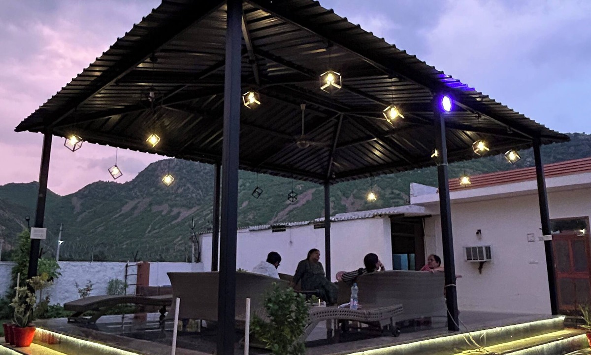 Alwar House | Nestled amidst majestic mountains, our farmhouse offers a serene and picturesque