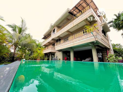 Nagaon House | Ocean Olive Villa by Staymist