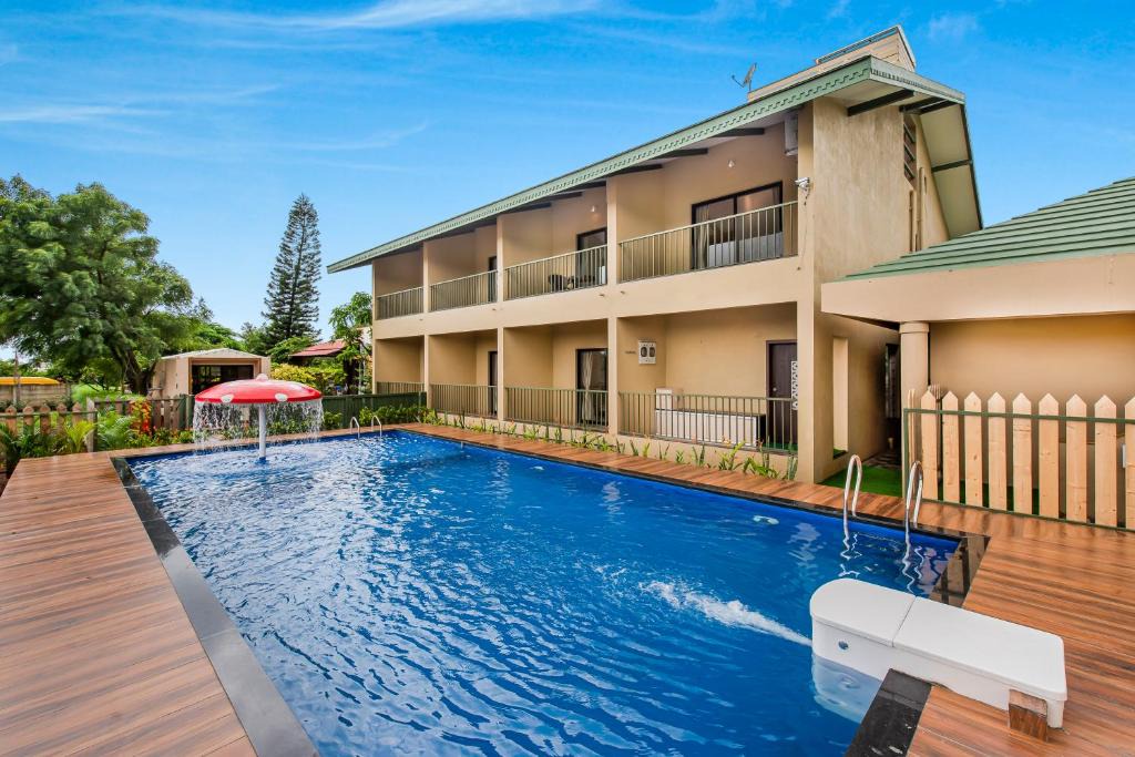 Nashik Villa | SaffronStays Amaltas, Nashik - pool villa with huge lawns perfect for large groups and corporate offsites
