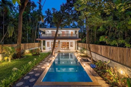 Nagaon Villa | SaffronStays Atmos - 3BR rustic pool villa with projector screen, table tennis, carrom & cozy family spaces in Nagaon