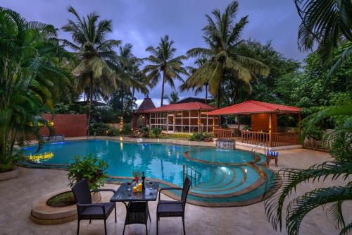Kihim Villa | SaffronStays Euphoria Shores - 6BR villa with bar counter, pool & lawns 400m from Kihim Beach in Alibaug