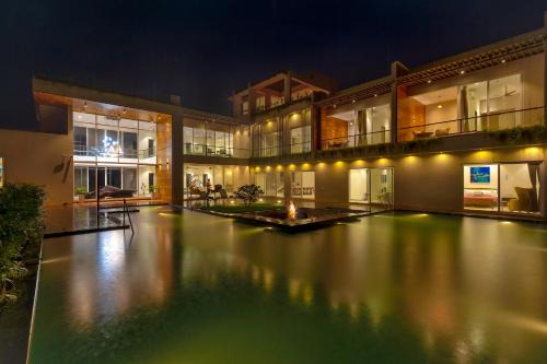 Karjat Villa | SaffronStays Grand Odyssy - 4BR luxury pool villa with sauna, game zone & lawn, perfect for weddings & parties in Karjat