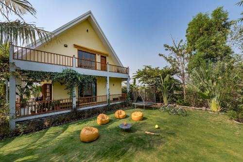 Wadgaon Villa | SaffronStays Happy Fields - Swimming pool farmhouse with farm views, hammocks & farm-to-table dining near Pune