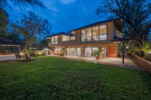 Wai Villa | SaffronStays Red Brick House - 3BR English-style villa with verandah dining, orchard lawn & classic charm