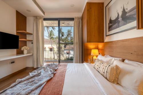 Nerul Villa | SaffronStays Rio - 4BR pet-friendly villa with glass-bottom pool, rooftop party zone & bar near Candolim & Coco Beach
