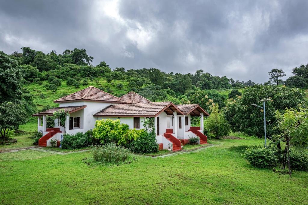 Pen Villa | SaffronStays Sattva - 2BR Konkani-style eco farmhouse with wood-fired copper baths, orchard, forest walks & stargazing