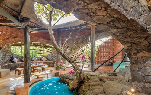 Vada Villa | SaffronStays Terracotta Trails - 2BR eco-luxury villa with earthy design, pool, open lawns & sustainable living in Wada