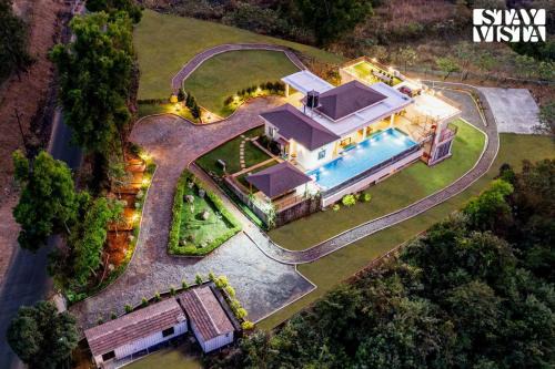 Javan Villa | StayVista at Beyond Infinity with Hill View, BBQ