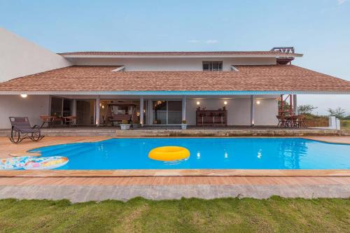 Nashik Villa | StayVista's Eva Villa - Lakeside Luxury with Modern Decor, Pool & Expansive Lawn - Near Sula