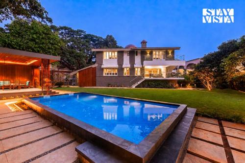 Parshwapuram Villa | StayVista's House Of J - Embrace Leisure with Lawn, Pool, and Gazebo