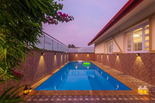 Kune Village Villa | StayVista's V Square - Enjoy a pool and indoor games for a leisurely stay