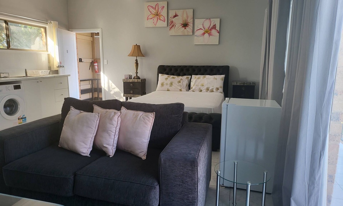 Windsor Apartment | Top View Deluxe Self-Contained Room No 3 with Balcony Overlooking Swimming Pool.