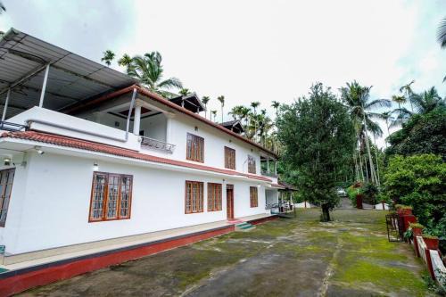 Krishnagiri Apartment | Wayanad Palm Grove Retreat 1st Floor
