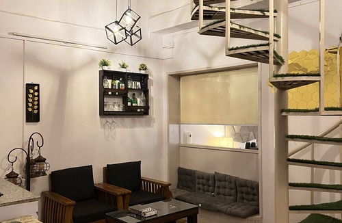 Hauz Khas Village Apartment | A king size bed and urban retreat in the heart of Hauz Khas Village.