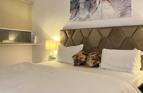 Hauz Khas Village Apartment | A king size bed and urban retreat in the heart of Hauz Khas Village.