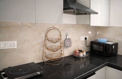 DLF Phase 5 Apartment | Amlatas Home, 1-bedroom apartment with AC in pleasant Gurugram location