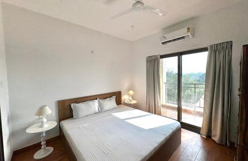 Sainagar Apartment | Boutique 1BHK Pool Retreat with Modern Amenities and Private Balcony