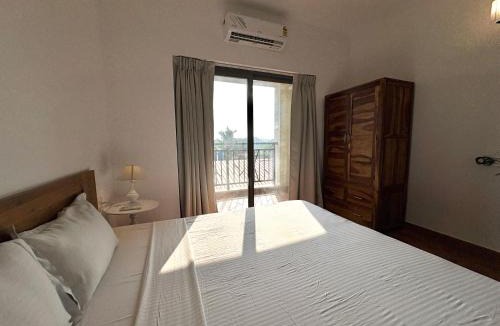 Sainagar Apartment | Boutique 1BHK Pool Retreat with Modern Amenities and Private Balcony