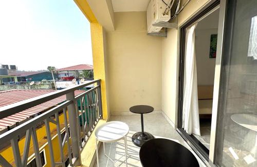 Sainagar Apartment | Boutique 1BHK Pool Retreat with Modern Amenities and Private Balcony