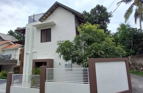 Nedumangad House | Cozy modern hideout on the outskirts of city help you freak out in silence .