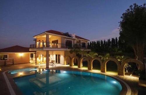 Anjar Villa | Desert Palms by StayVista in Kutch, nestled in orchards, features a swimming pool and a scenic balcony for a serene getaway