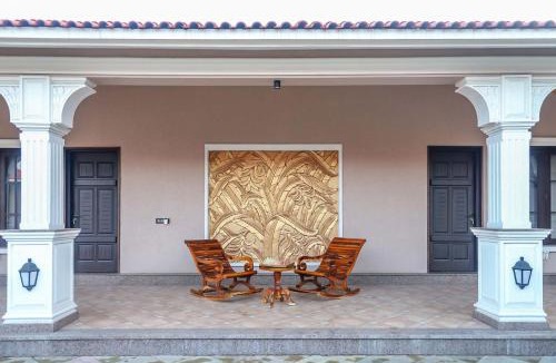 Anjar Villa | Desert Palms by StayVista in Kutch, nestled in orchards, features a swimming pool and a scenic balcony for a serene getaway