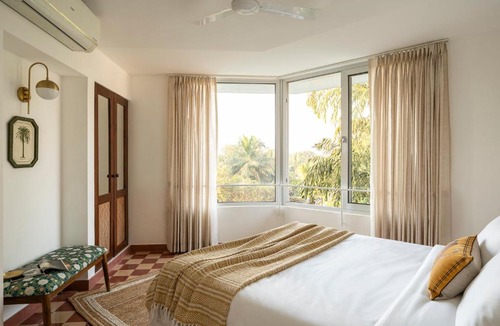 Nerul Apartment | El Volar by The Blue Kite - 2BHK, 5 Mins to Casino & 10 Mins to Candolim Beach with Big common Pool, Fully Equipped Kitchen, 24x7 Security, WiFi