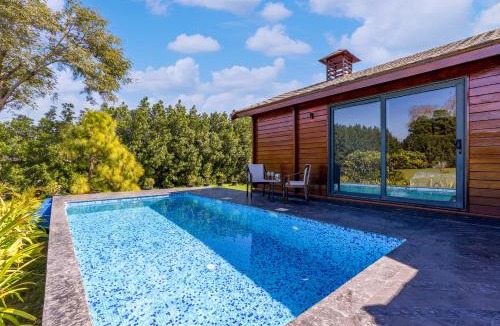 Dubbi Villa | ELIVAAS Riveira Hills - 3 BHK Wooden Cottage with Lush Garden, Pvt Pool