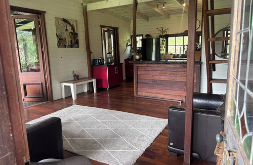 Blue Knob House | Hidden among lush rainforest and towering palms, a charming family retreat