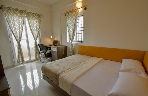 Palm Meadows Apartment | HomeSlice Whitefield - 1BHK, 2BHK Service Apartment