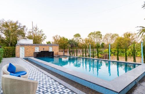 Village Hokra Villa | Krishna Serenity Villa Pet-friendly 7-BHK Farmhouse with Pool, Gazebo and Garden