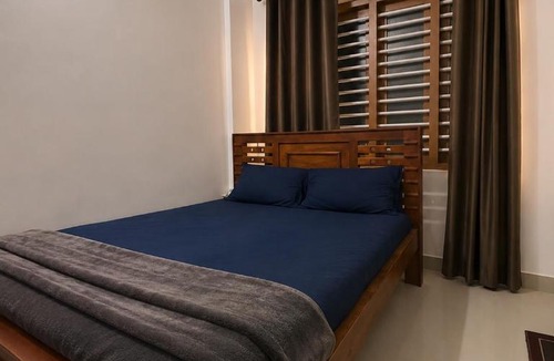 Kozhikode House | lQ Rooms