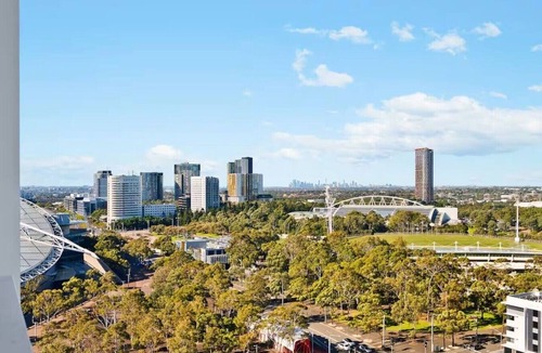 Lidcombe Apartment | Luxurious Pool View at Sydney Olympic Park