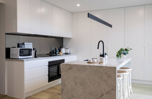 Oatley House | Luxurious Waterfront Retreat with Tennis Court