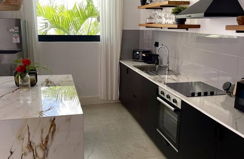 Galu Beach Apartment | Luxury Diani Escape for 5 – Pool, Chef & Transfers