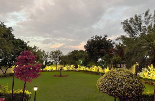 Alwar House | Nestled amidst majestic mountains, our farmhouse offers a serene and picturesque
