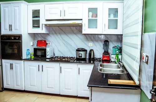 Msasani Apartment | Oasis of serenity/2BR flat w standby gen &backyard