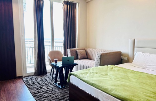 Jaypee Greens Apartment | PrimeStays Studio | Couples, Work & Travel Ready near expo mart greater noida