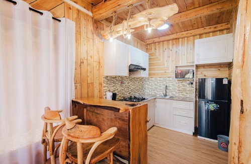 Naivasha Cabin | Rustic A-frame cabins blending natural wood,glass and serene outdoor living
