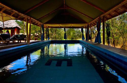 Mikumi National Park Cabin | Sable Mountain Lodge, A Tent with a View Safaris