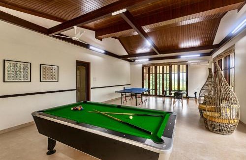 Karjat Villa | SaffronStays Ananya - 4BR villa with pool, minibar & game room near river Ullas in Karjat