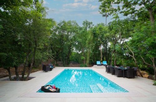 Alibaug Villa | SaffronStays Arabella - 4BR bohemian pool villa with sunken lounge, foosball, PS4 & mango orchard views in Alibaug