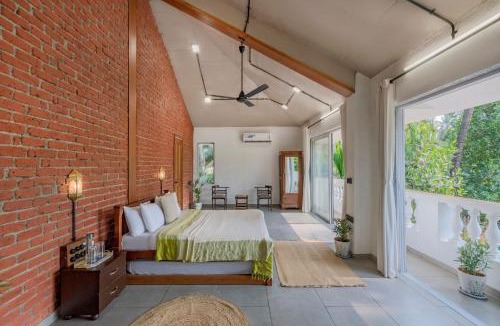 Nagaon Villa | SaffronStays Atmos - 3BR rustic pool villa with projector screen, table tennis, carrom & cozy family spaces in Nagaon