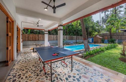 Nagaon Villa | SaffronStays Atmos - 3BR rustic pool villa with projector screen, table tennis, carrom & cozy family spaces in Nagaon