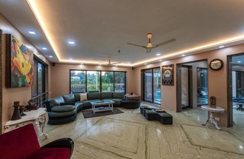 Alibaug Villa | SaffronStays Aura - 4BR luxury pool villa with gym, BBQ deck, lawns & indoor games near Kihim Beach
