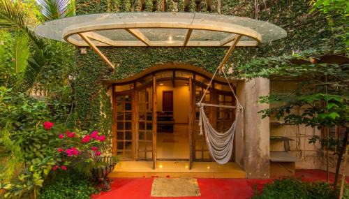 Mumbai Villa | SaffronStays Birdsong - 3BR pet-friendly villa with lawns, treetop terraces, gazebo dining & tennis court