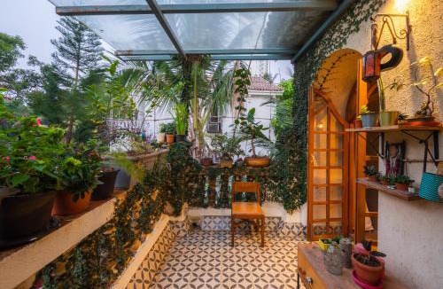 Mumbai Villa | SaffronStays Birdsong - 3BR pet-friendly villa with lawns, treetop terraces, gazebo dining & tennis court