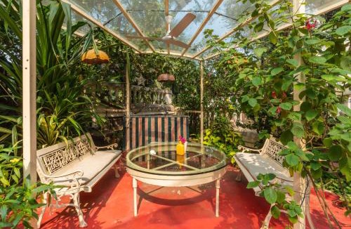Mumbai Villa | SaffronStays Birdsong - 3BR pet-friendly villa with lawns, treetop terraces, gazebo dining & tennis court